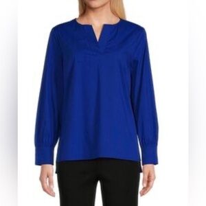 Ming Wang cobalt blue long-sleeve blouse with a V-neck and button cuffs.